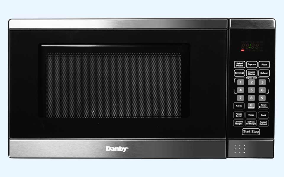 Danby appliances countertop microwave with stainless steel trim, right-side control panel, and glass door shown in a clean front view on a plain background