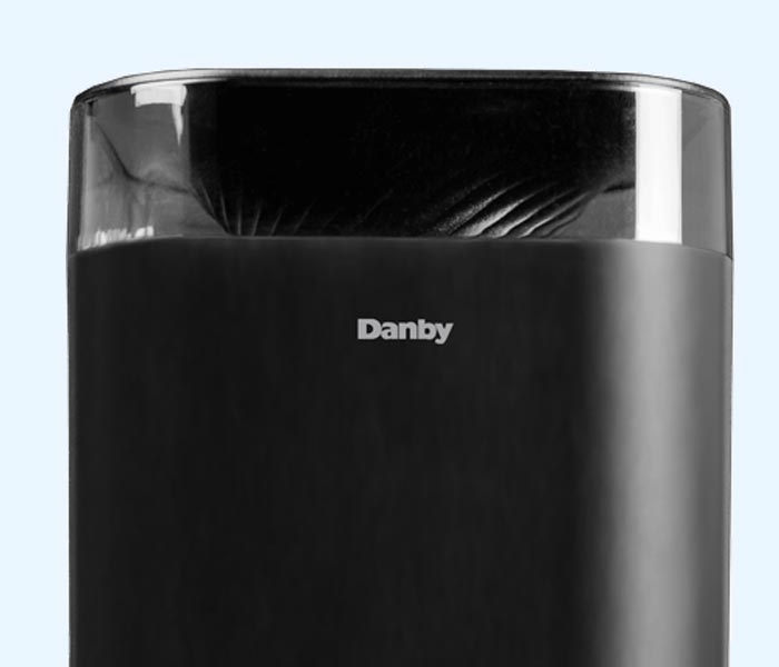Danby appliances air care humidifier with a black finish and transparent top section showing mist outlet, displayed in a close-up front view on a plain background
