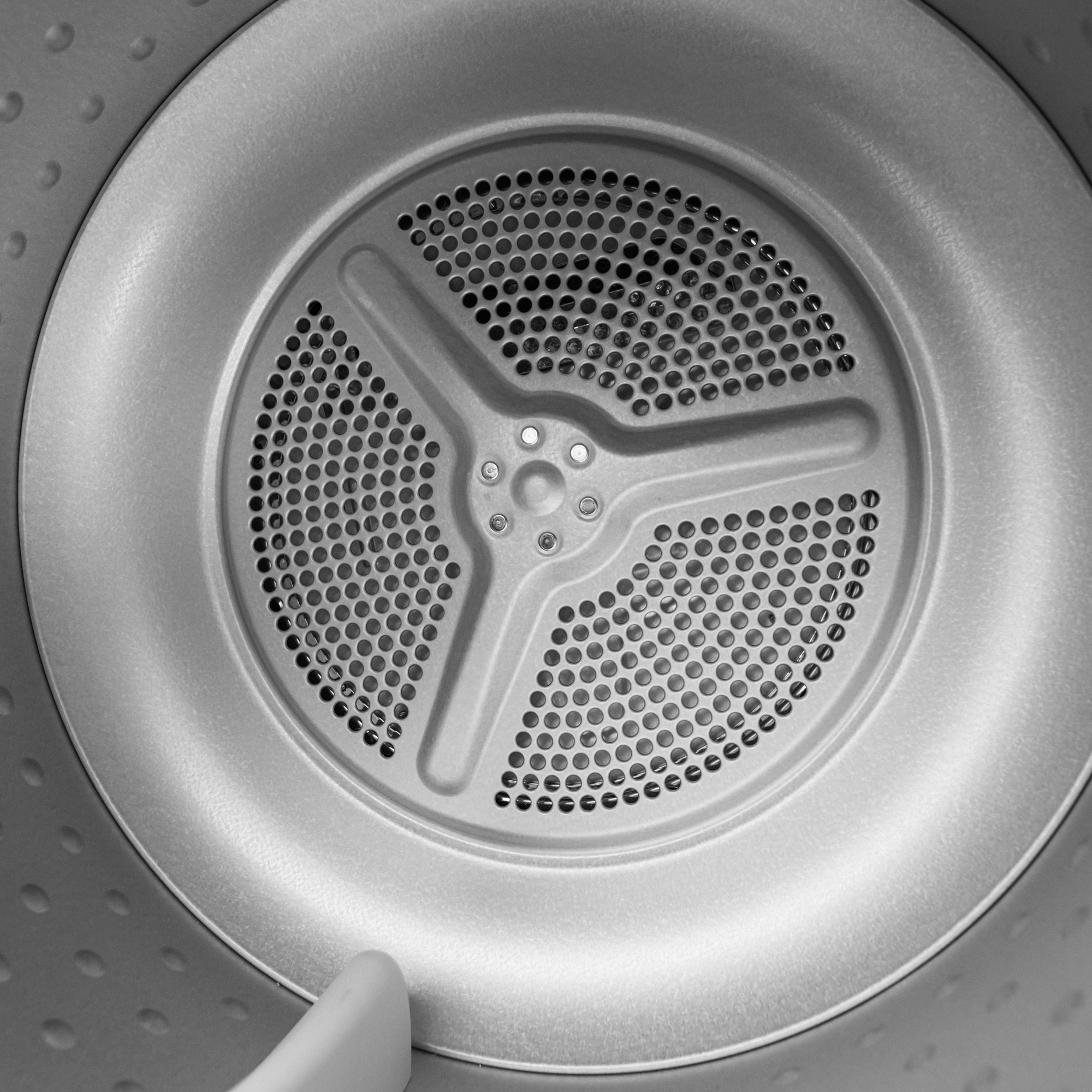 Danby DDY040D1DSDB 24 inch compact condensing dryer interior showing stainless steel drum and perforated design