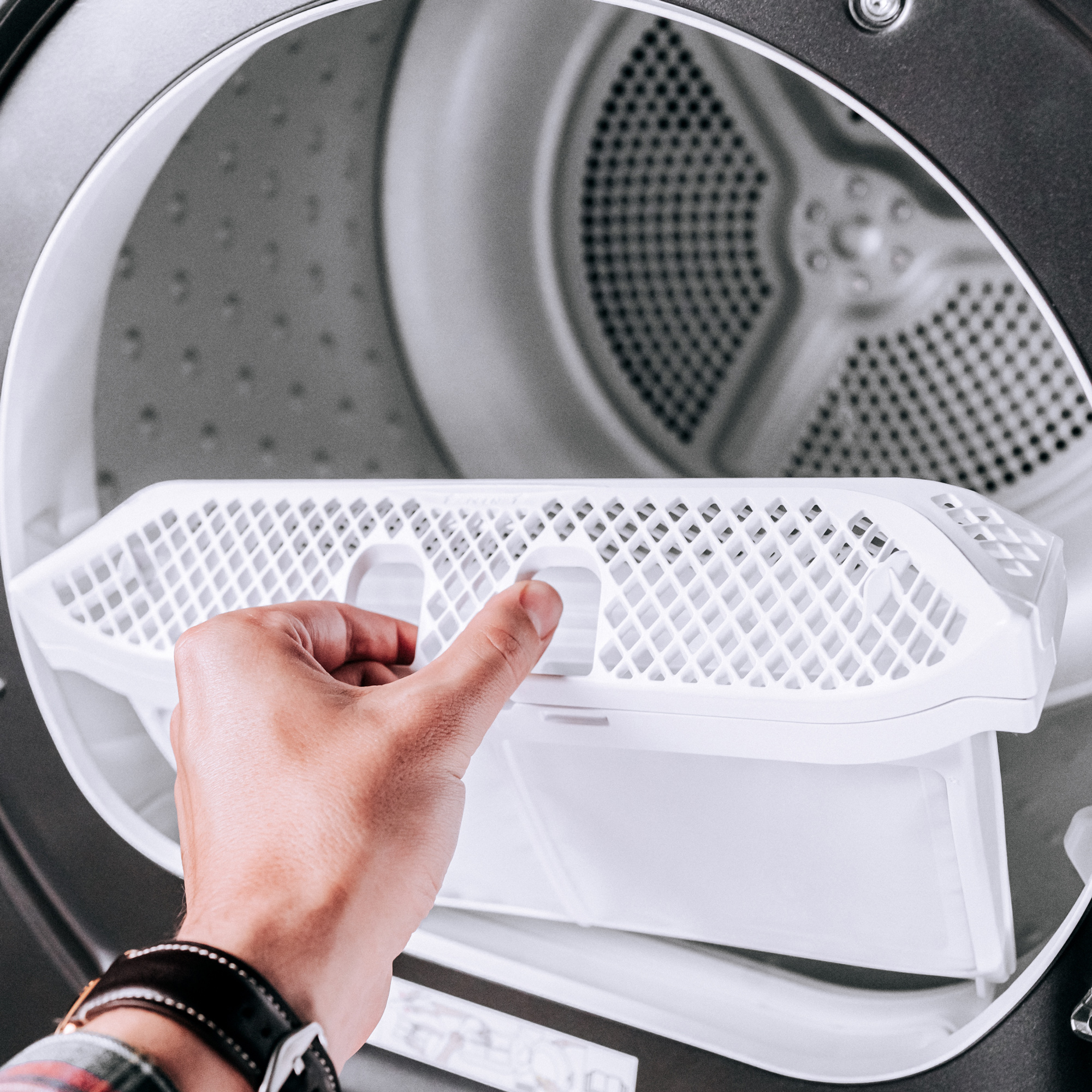 Danby DDY040D1DSDB 24 inch compact condensing dryer with door open showing drum access