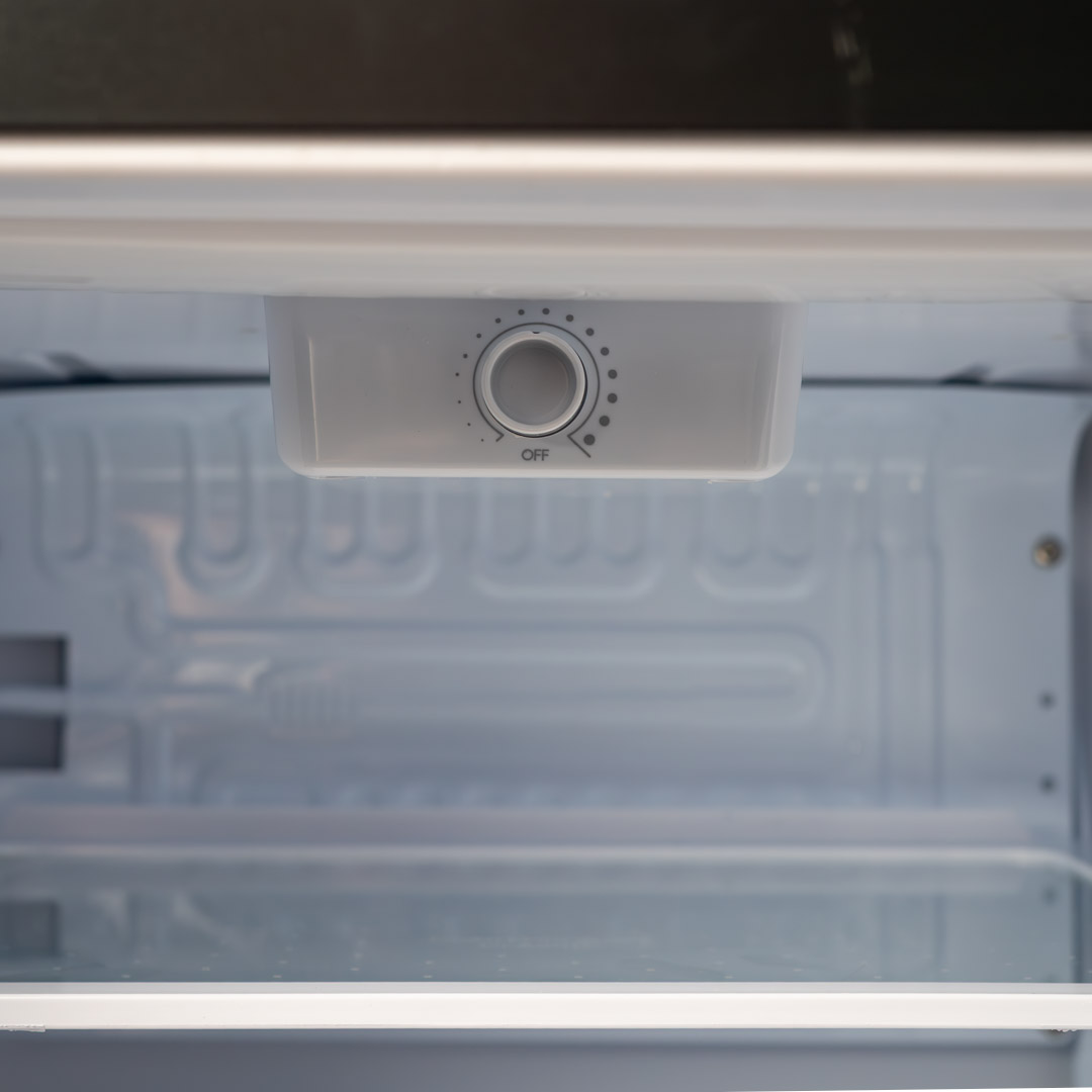 Danby appliances 1.7 cu ft compact fridge stainless DAR017A3BSS close-up of interior temperature control dial located under the top panel