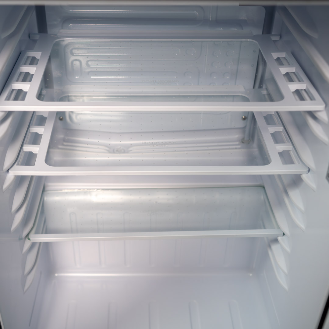 Danby appliances 2.6 cu ft compact fridge stainless DAR026A2BSLDB close-up of interior wire shelves and storage layout inside the cabinet