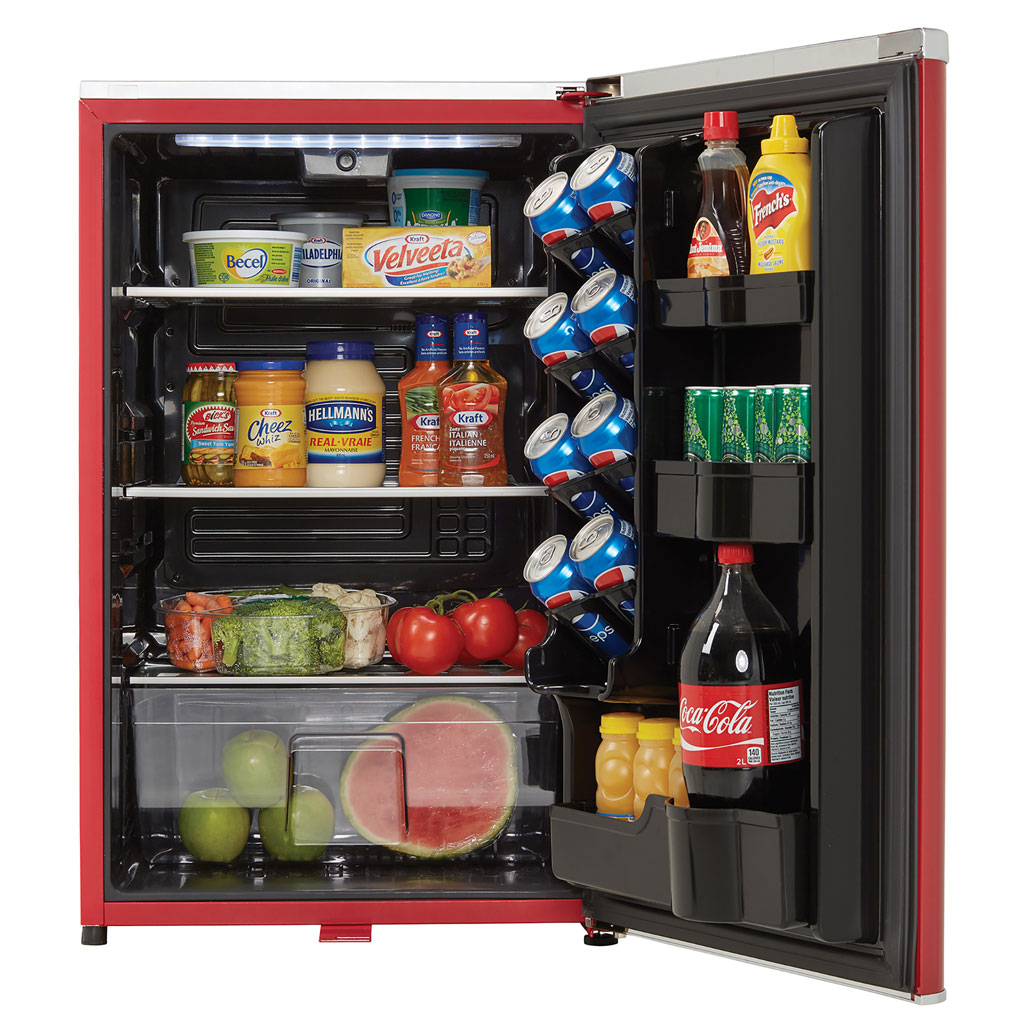Danby appliances 4.4 cu ft compact fridge red DAR044A6LDB open front view showing interior fully stocked with beverages, fruit, vegetables, and food items on glass shelves