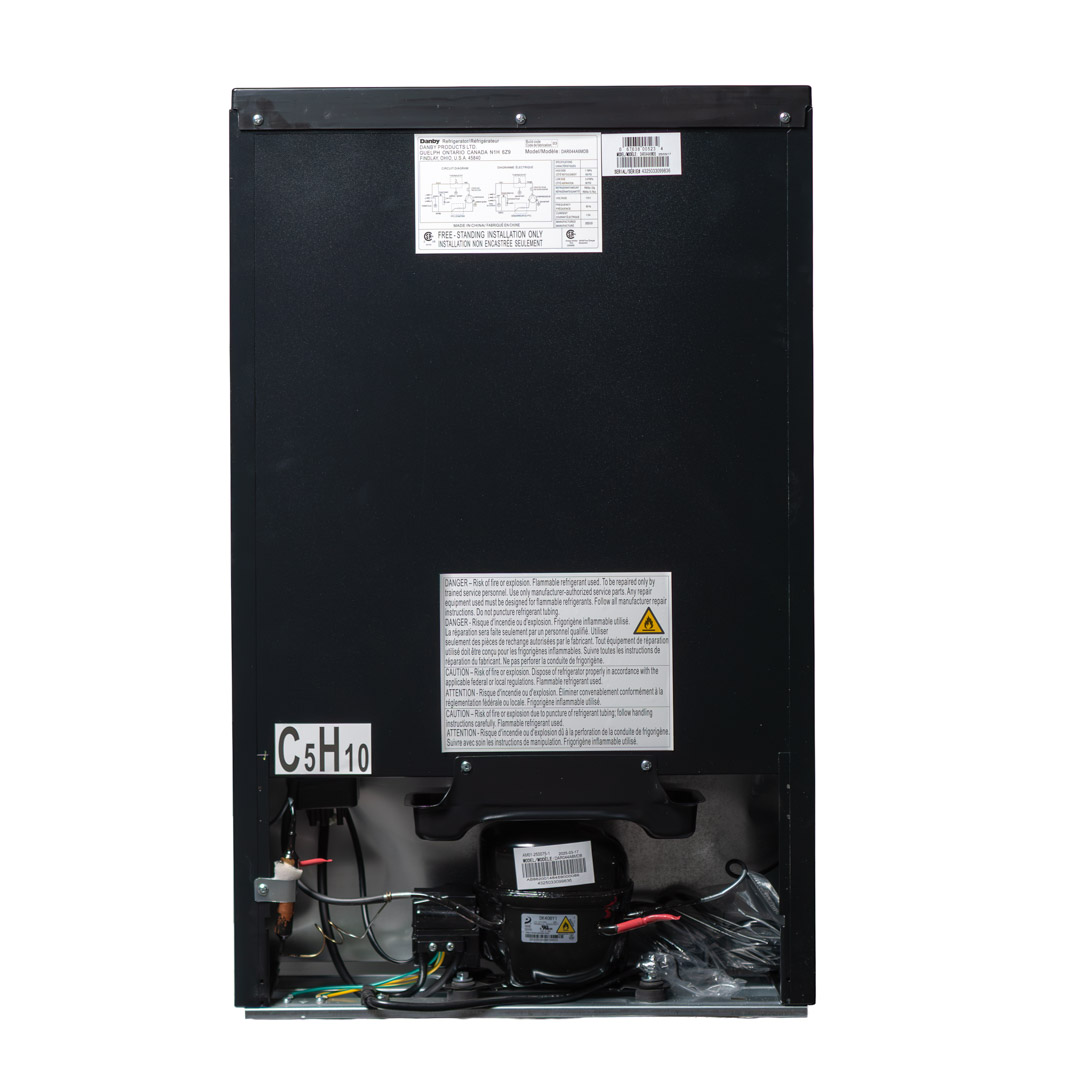 Danby appliances 4.4 cu ft compact fridge black DAR044A6MDB rear view showing back panel, ventilation area, and compact cabinet structure