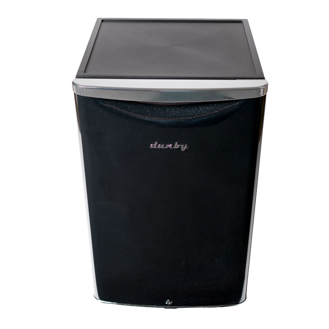 Danby appliances 4.4 cu ft compact fridge black DAR044A6MDB upper angled view showing flat worktop surface and cabinet design