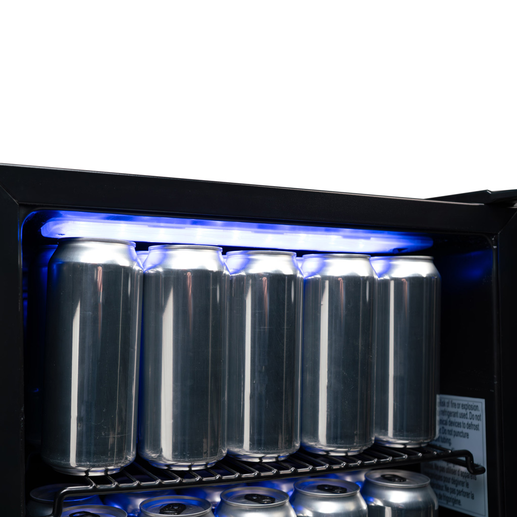 Danby 2.6 cu. ft. Free-Standing Beverage Center in Stainless Steel 11 Danby appliances 2.6 cu ft beverage center stainless DBC026A1BSSDB close-up of beverage cans on interior shelf under blue LED lighting