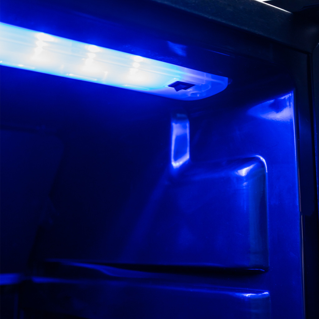 Danby appliances 3.1 cu ft beverage center stainless DBC117A1BSSDB-6 close-up of interior blue LED lighting illuminating the cooling fan and back panel inside the cabinet