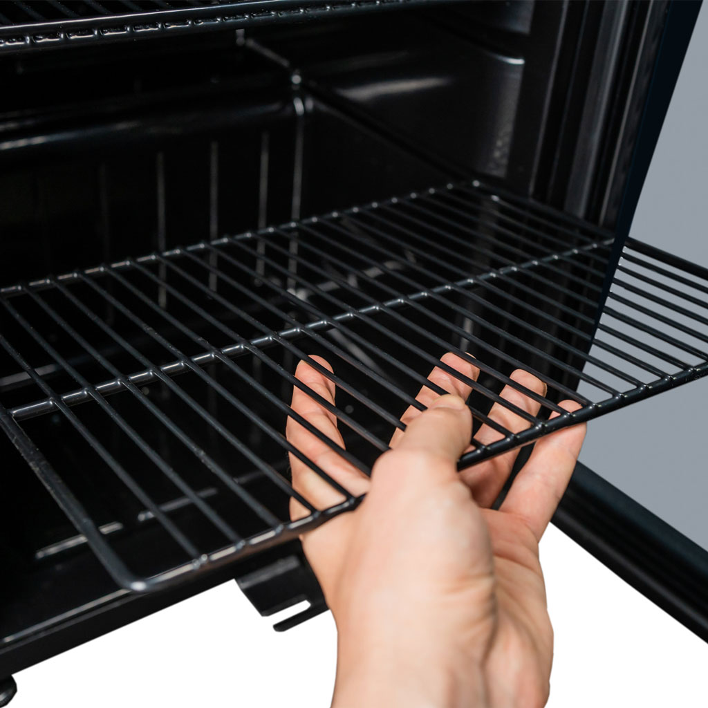 Danby appliances 3.1 cu ft beverage center stainless DBC117A1BSSDB-6 close-up showing removable wire shelf being adjusted inside the cabinet