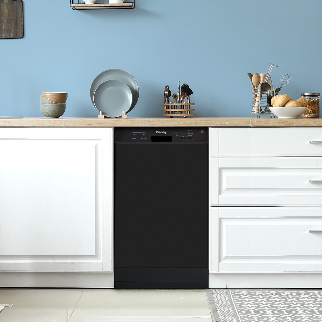 Danby appliances 18 inch built in dishwasher black DDW18D1EB installed in a modern kitchen with white cabinetry and wooden countertop shown in a front view