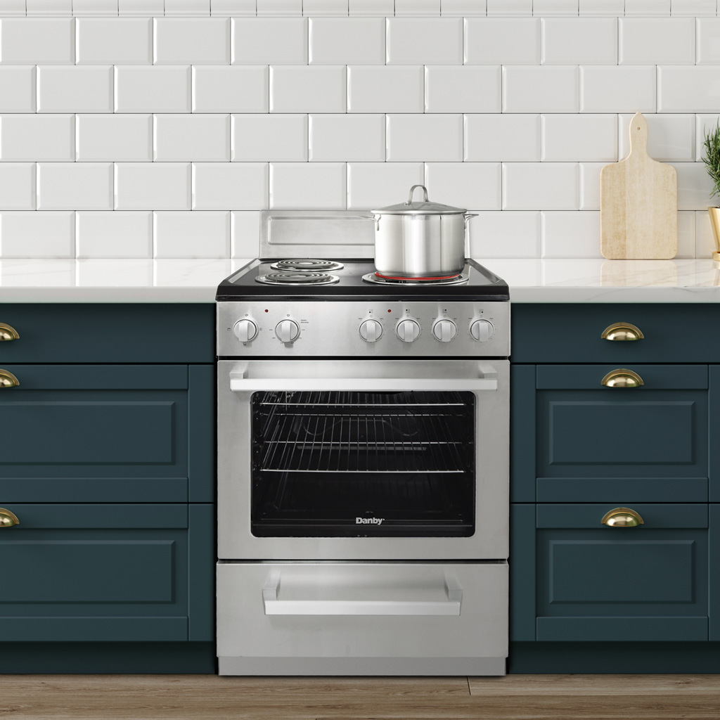 Danby DERM240BSSC 24 inch electric range in kitchen setting with cabinetry and countertop