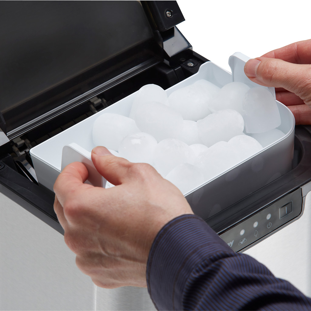 Danby DIM2500SSDB 25 lbs ice maker removable ice basket being lifted from interior compartment