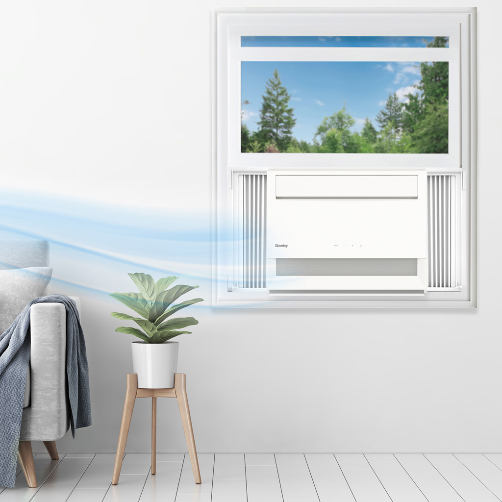 Danby DAC100B6WDB 10000 BTU window air conditioner installed in bedroom window providing cooling comfort