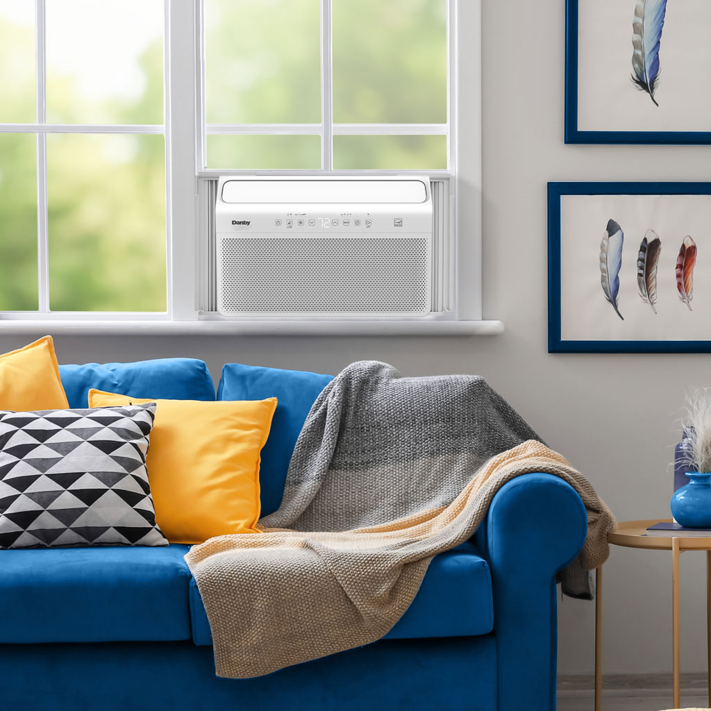 Danby DAC100B8IWDB-6 10000 BTU inverter window air conditioner installed in living room window providing cooling comfort