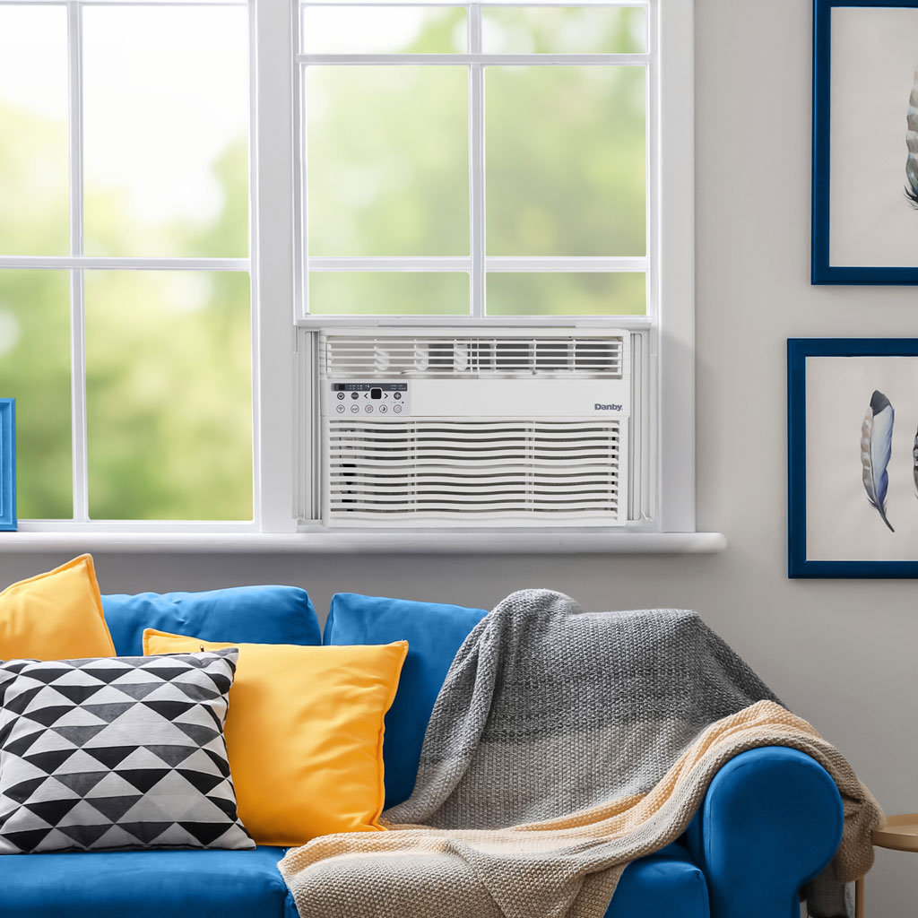 12,000 BTU Window Air Conditioner - Cools Up To 550 sq. ft. - Refurbished 6 Danby DAC120EB8WDB 12000 BTU window air conditioner installed in living room window providing room cooling