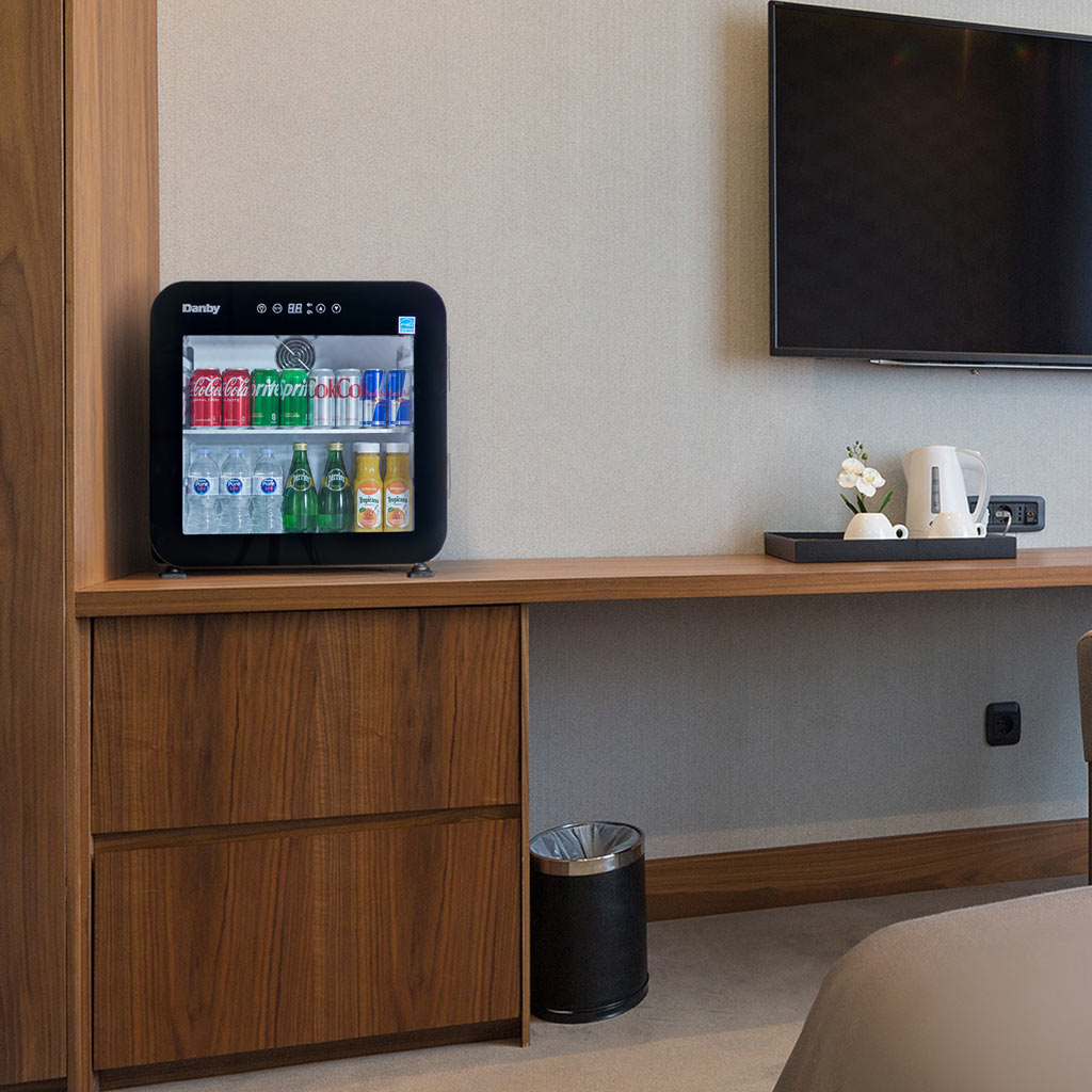 Danby DAG016A5BDH 1.6 cu ft glass door mini refrigerator in entertainment space with beverage storage