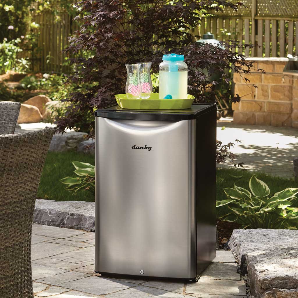 Danby DAR044A6BSLDBO 4.4 cu ft outdoor fridge in outdoor entertaining space with stainless steel finish
