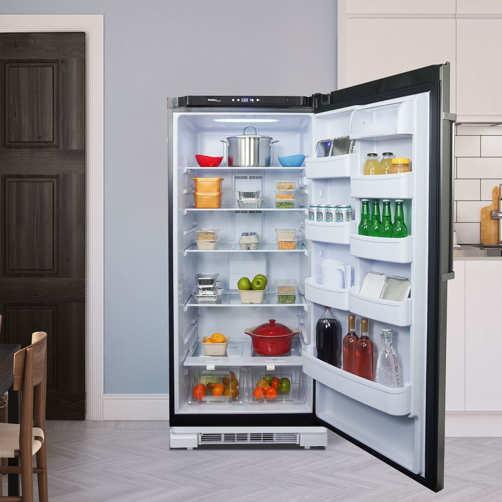 Danby DAR170A3WDD 17.0 cu ft apartment fridge with door open displaying food and beverage storage in home setting