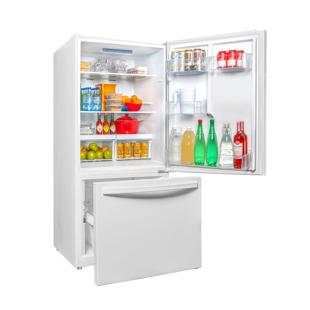 Danby DBM187E1WDB 18.7 cu ft apartment fridge angled view with door open displaying food and beverage storage