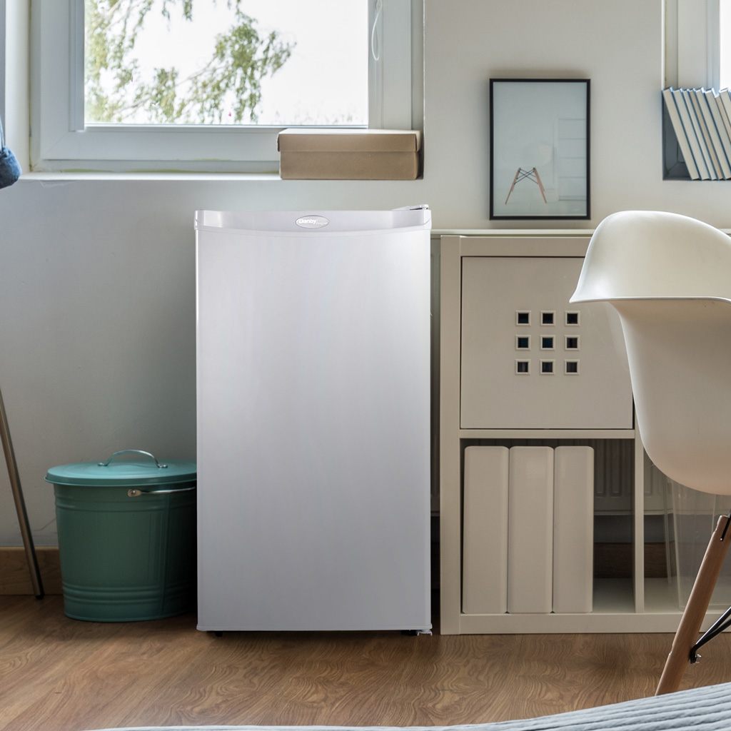 Danby DCR032A2WDD 3.2 cu ft compact fridge in kitchen setting with food and beverage storage