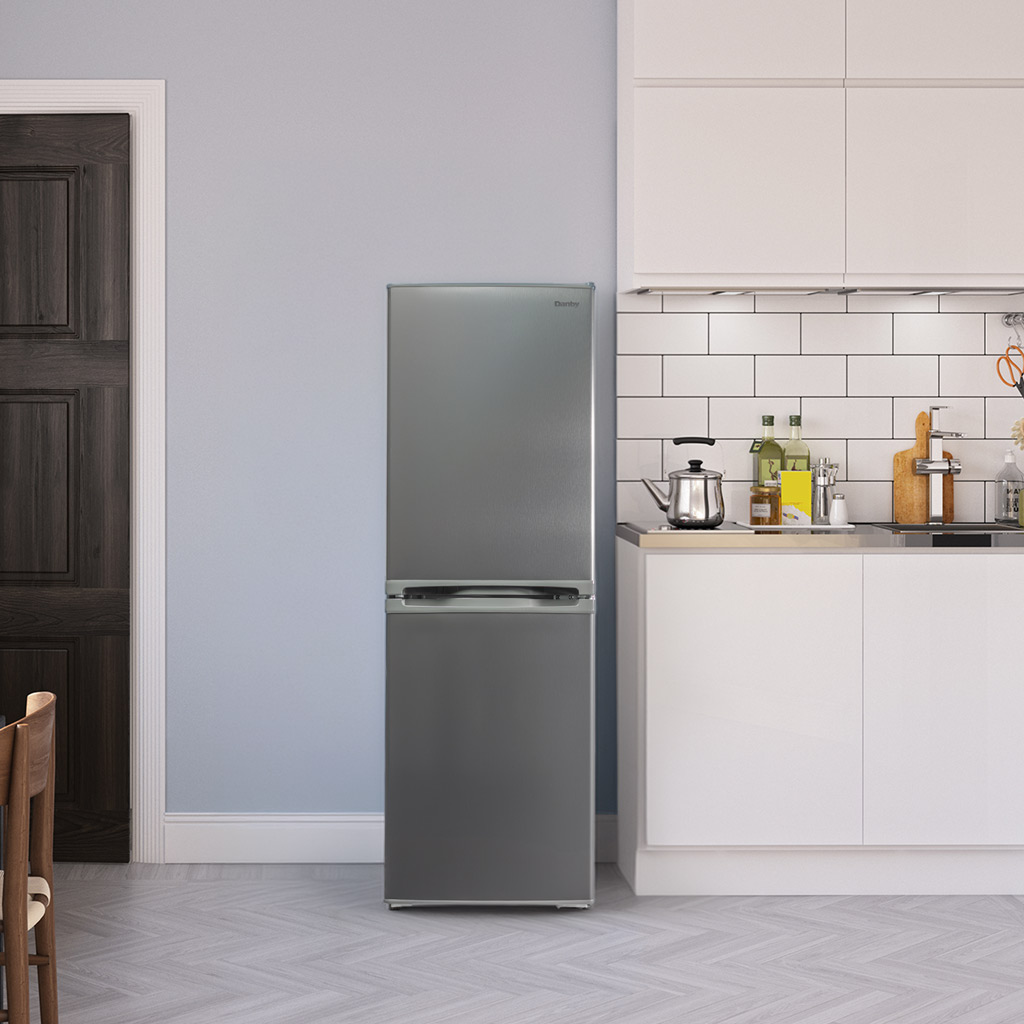 19 Inch 4.9 cu. ft. Bottom Mount Mini Refrigerator 6 Danby DCR049B1BSLDB 4.9 cu ft mini fridge placed next to kitchen counter with cabinets and tile backsplash
