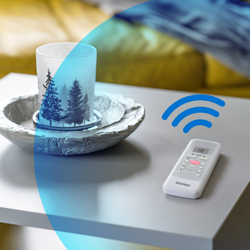 Danby DPA080B2WDB 12000 BTU air conditioner remote control on table showing wireless connectivity