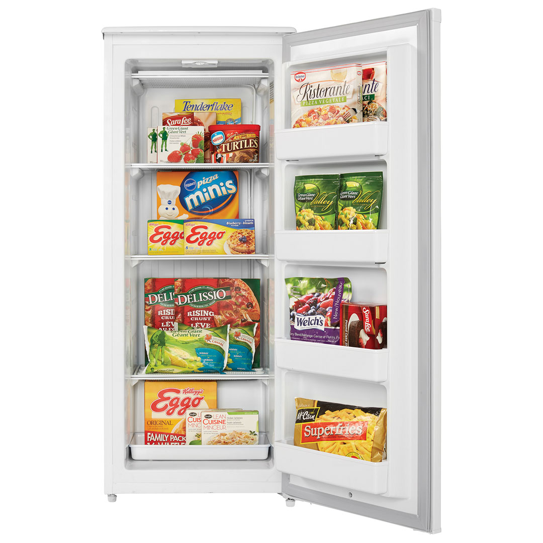 Danby Designer 10.1 cu. ft. Upright Freezer in White 8 Danby DUFM101A2WDD 10.1 cu ft upright freezer with door open displaying frozen food storage
