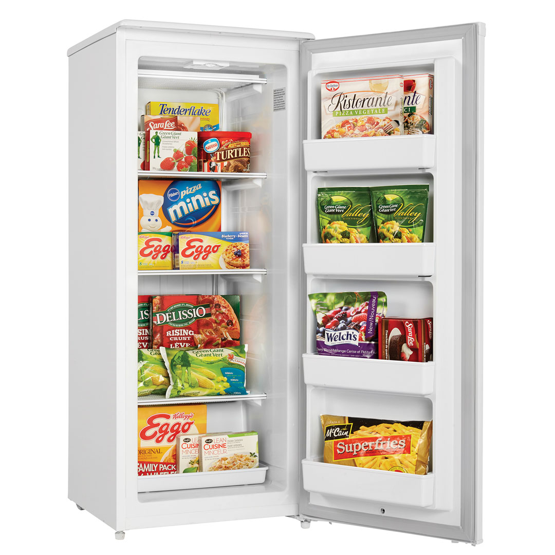 Danby Designer 10.1 cu. ft. Upright Freezer in White 10 Danby DUFM101A2WDD 10.1 cu ft upright freezer with door open displaying frozen food storage
