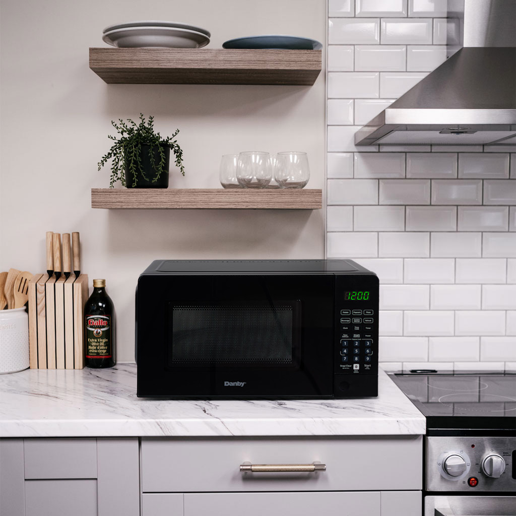 0.7 cu. ft. Countertop Microwave – 700 W 5 Danby DMW071A1B 0.7 cu ft countertop microwave on kitchen countertop in a modern kitchen setting