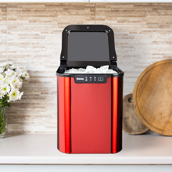 Danby ice maker with lid open showing fresh ice and illustrating the benefit of having an ice maker at home
