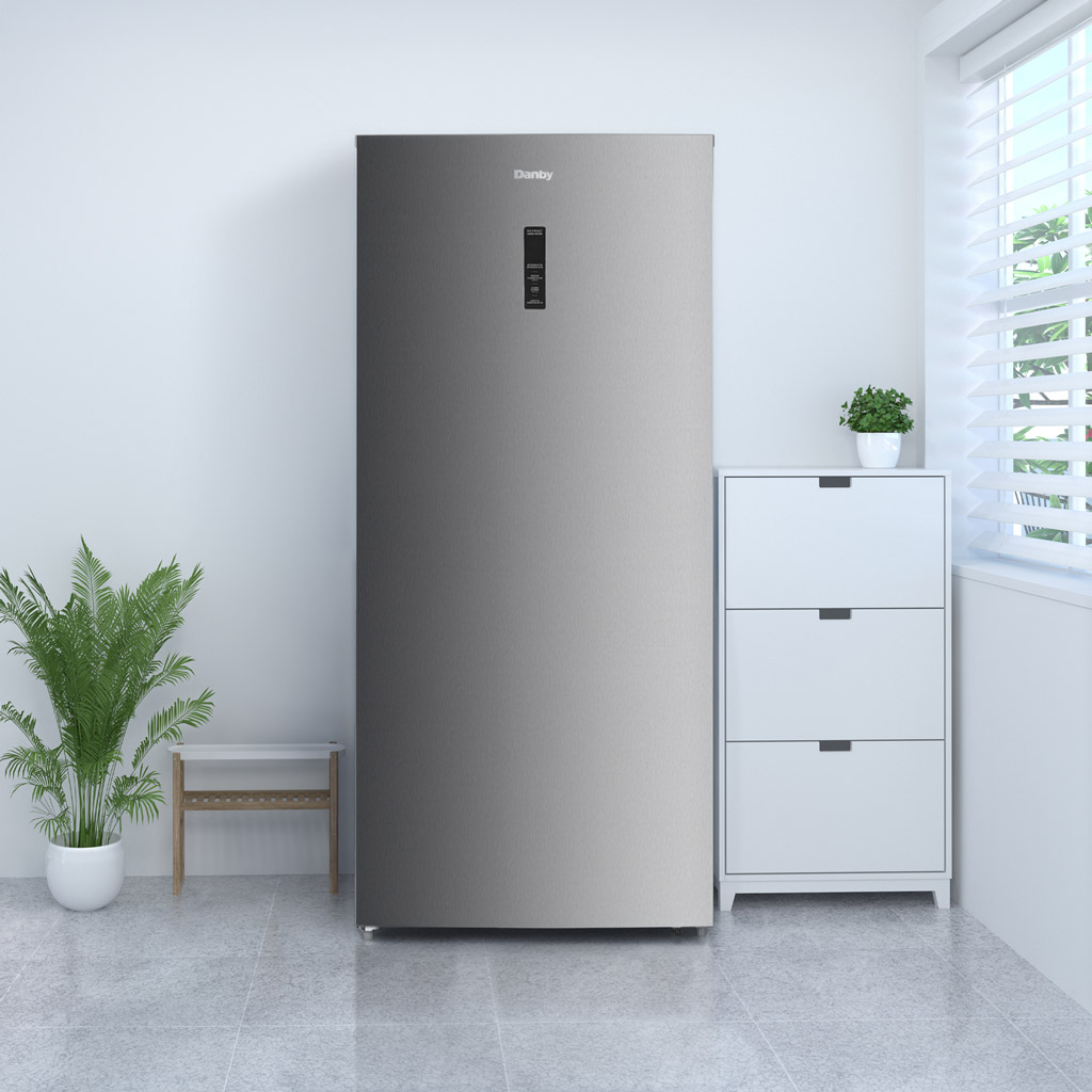 Danby DUF212B1SLCDB 21.2 cu ft upright freezer in home setting with convenient frozen food storage